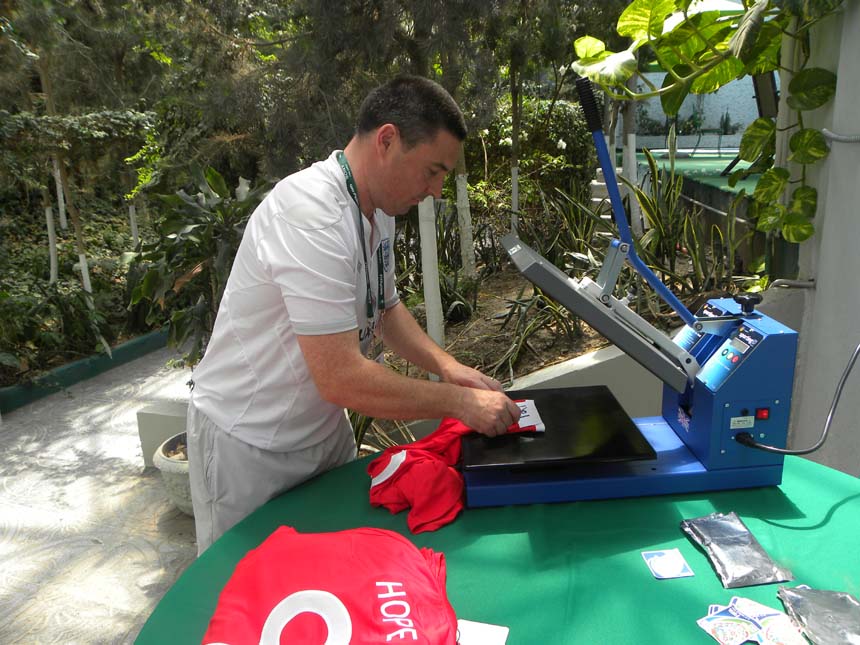 Neil Smith prints the matchday shirts out.